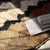 Jagged zigzag lines march across ivory in a vivid procession of crimson, taupe, sage, and midnight black, turning this rug...