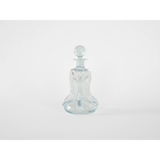 The handcrafted decanter from the Danish Holmegaard glassworks, model ‘Kluk’, is a classic of Scandinavian functional...