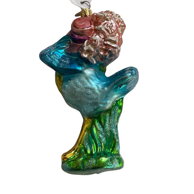 This charming 1999 Christopher Radko “Dressed to Trill” ornament is a festive addition to any Radko collection. With the...