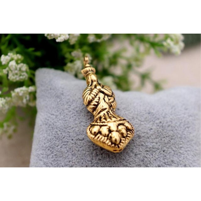 19.2K Gold Our Lady of the Immaculate Conception Pendant, in Worn conditions. Designed 1920 to 1949