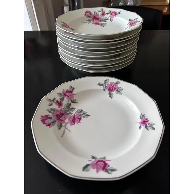 Limoges porcelain service made by MC & Cie in the 20s/30s decoration of stylized flowers and silver edging 11 soup plates...