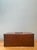 This vintage keyhole wooden box is a beautifully understated example of mid-20th-century craftsmanship, defined by its...