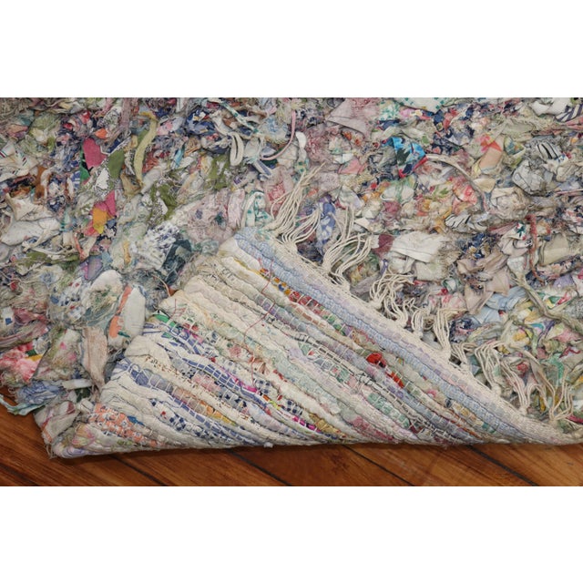 One of a kind American Braid throw size rug from the late 20th century with a borderless confetti pattern Measures: 2'2''...