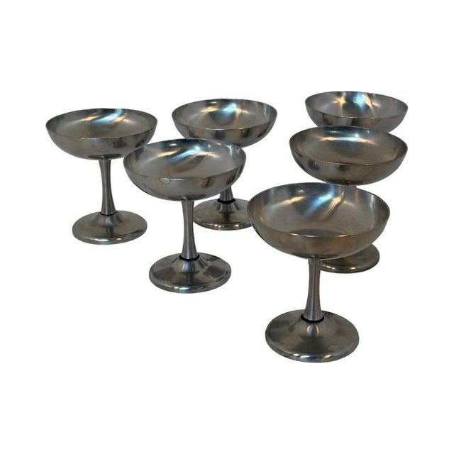 Set of six stainless steel martini glasses / flutes. Marked at the bottom with Spring Switzerland. Great little glasses...