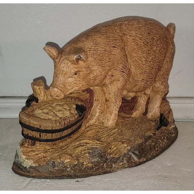 20thc Iron Door Stop in original painted surface.The pig is quite unusual form.