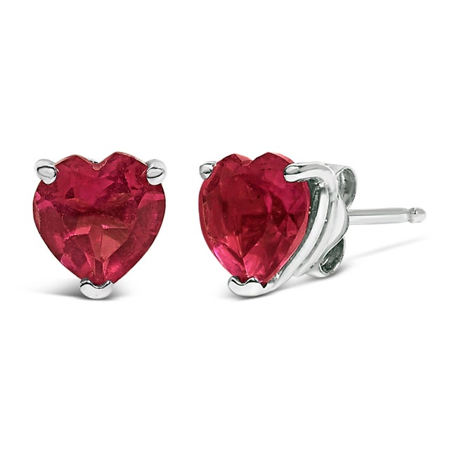 Discover the quintessence of elegance with these heart-shaped red ruby stud earrings, exquisitely cradled in 14K white...