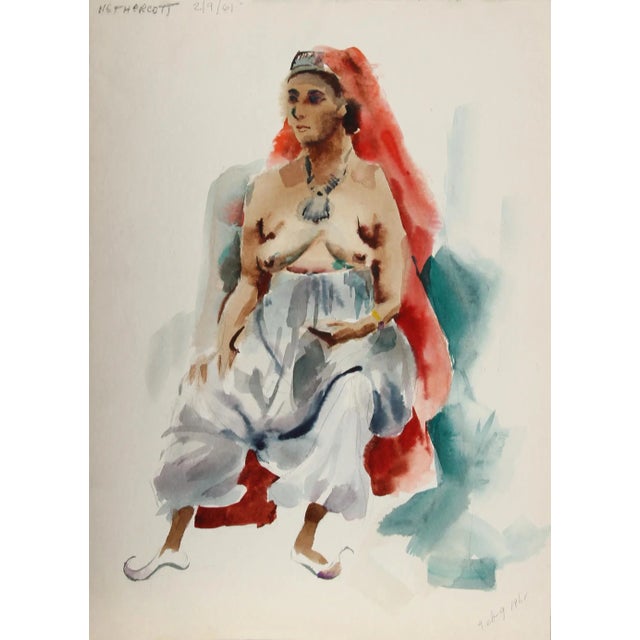 Wearing a red headdress that trails down the length of her body, the topless woman looks away from the viewer and rests...