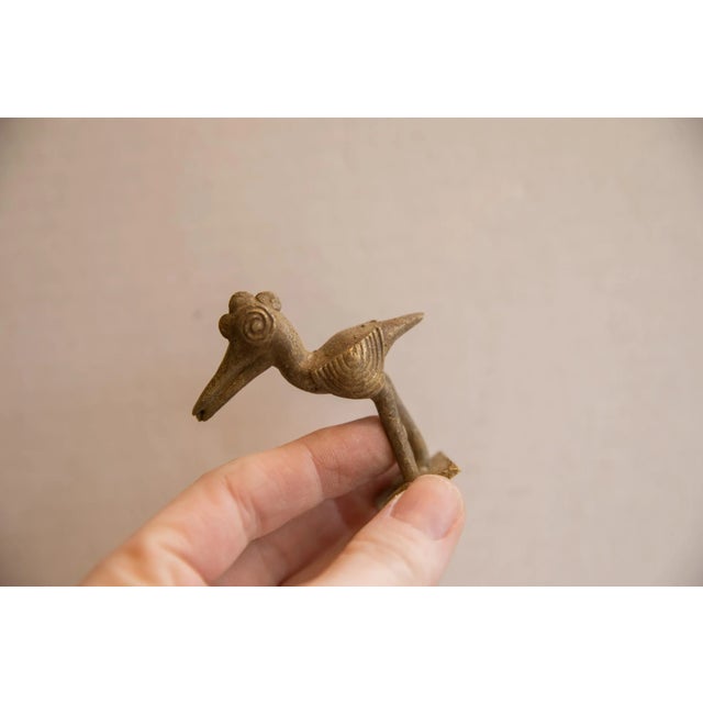 :: Vintage handmade African imperfect crowned bird figurine. Circa late mid 20th century, though possibly older, this...