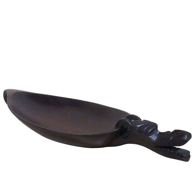 This smooth line and polished black dragon bowl is crafted by a local artisan. Fruit bowl or decorative table art....