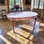 Presenting an exceptional antique French dining table of outstanding craftsmanship and timeless elegance. This antique...