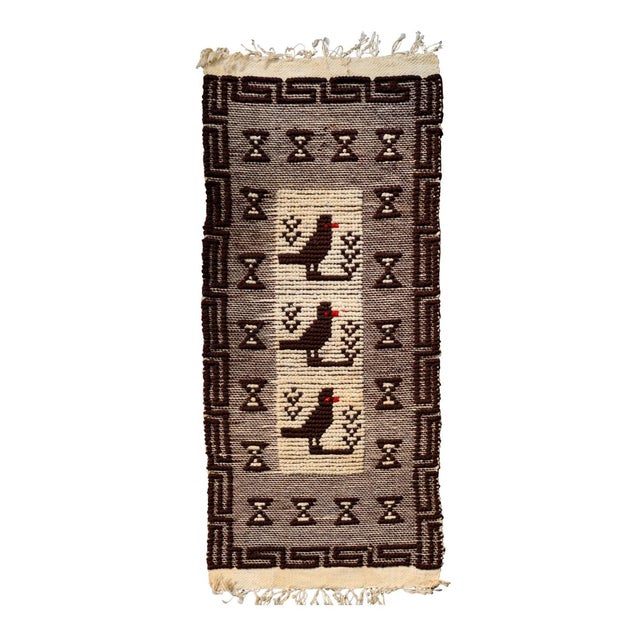 A small hand-woven Mid-Century wall tapestry with birds and geometric designs. The tapestry was made in Poland, a source...