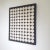 Canvas wrapped in leather and inlayed with symmetrical circles. Crisp off-white bone on a black background. This piece was...