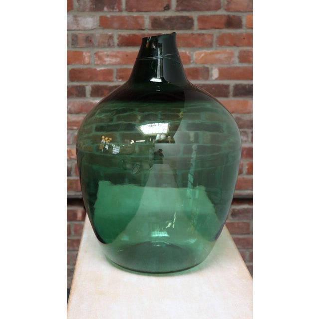 French Demijohn / Carboy originally used for transporting wine (early 20th Century, France). Composed of attractive teal...