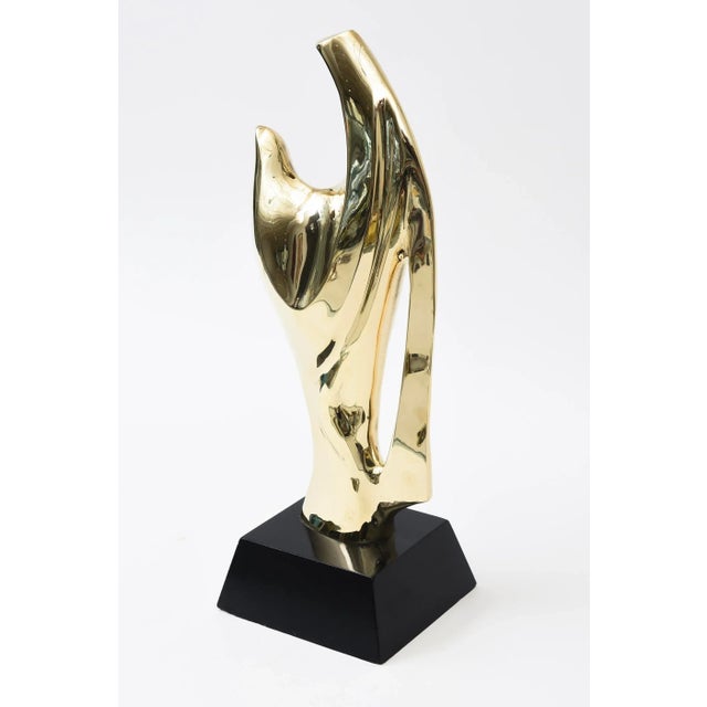 This modernist vintage brass and black wood abstract sculpture is by Alain Chervet from the 70;s. He is French. It can go...