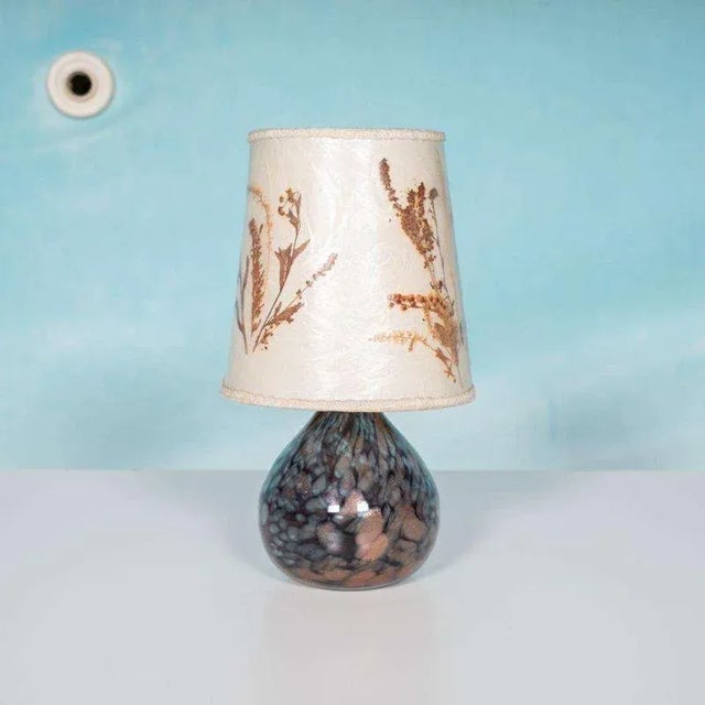 Impressive vintage table lamp with refined details, originating from Scandinavia and carefully selected during one of our...