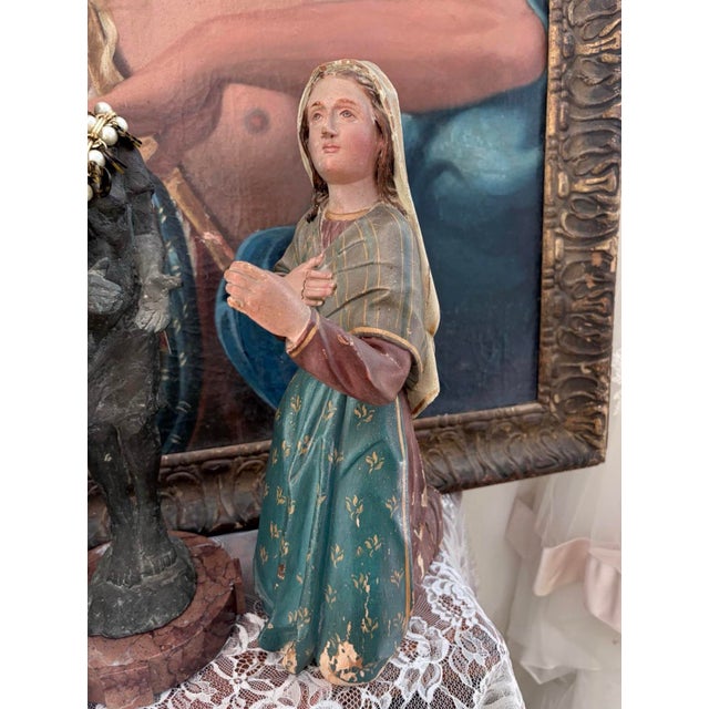 Beautiful antique hand-carved polychrome wood devotional figure depicting a kneeling young woman in prayer. The figure...