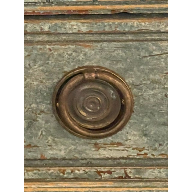 The product is a pair of Swedish Gustavian Neoclassical painted chests. These chests feature a neoclassical design with...