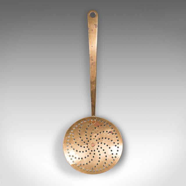 Our Stock # 24239 This is an antique fireplace warmer. An English, brass chestnut roasting plate, dating to the Georgian...