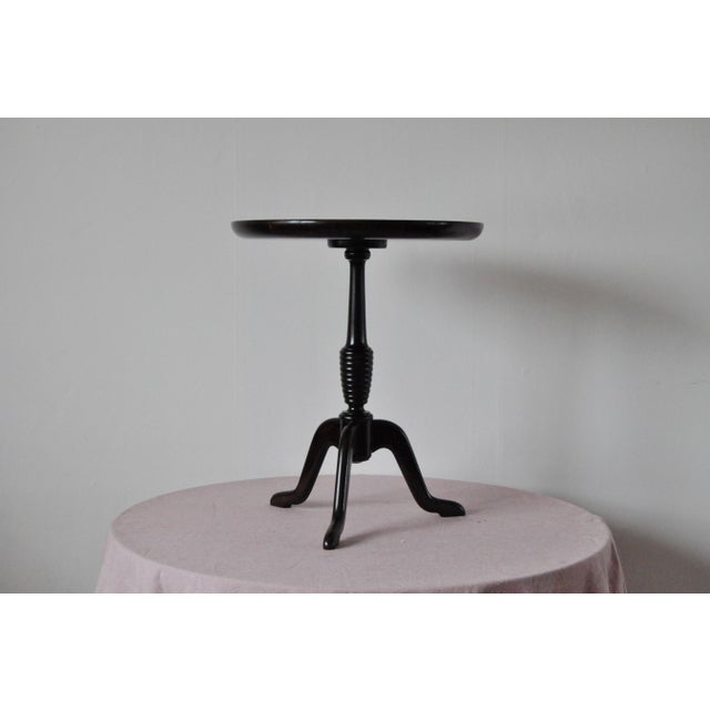 Side table in dark stained beech with tripod legs. Made by cabinetmaker Anton Kildeberg, Denmark, 1950s Very fine...