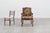A richly expressive Louis XV–style armchair in carved walnut, crafted in France around 1900 and tailored to the refined...