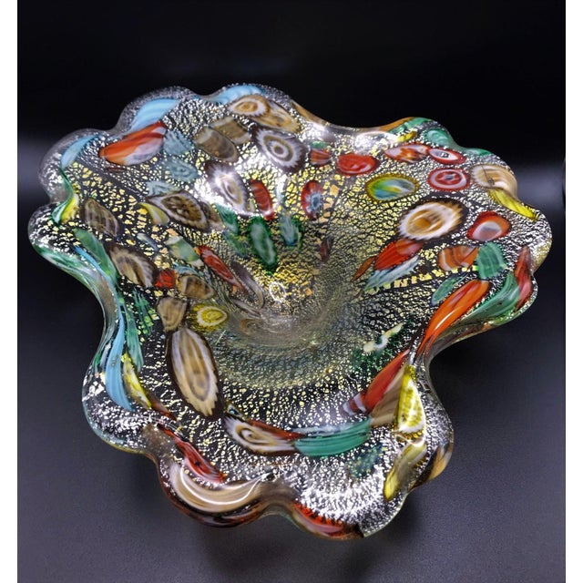The object is a very pretty Murano free form hand blown object that contains gold flecks and made from many colorful rods...