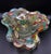 The object is a very pretty Murano free form hand blown object that contains gold flecks and made from many colorful rods...