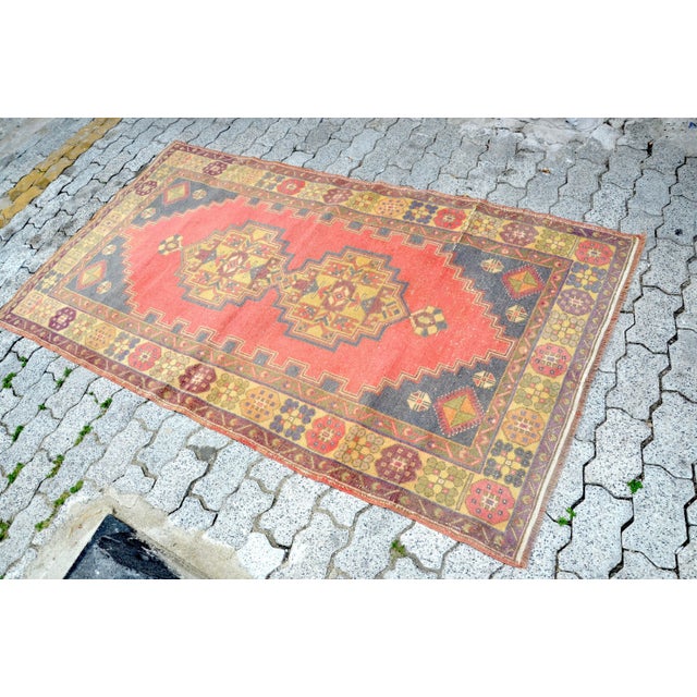 This is a vintage Turkish Oushak rug from the 1960s. The piece was hand-knotted.
