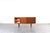 This teak sideboard was manufactured in Denmark in the 1960s. The piece of furniture has four drawers and a sliding,...