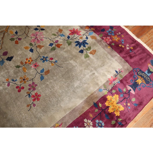 Stunning large Chinese Art Deco rug with a beautiful floral design with a silver field and plum border. Room size formats...
