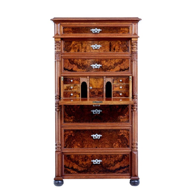 striking walnut and burr walnut 7 drawer chest, which is often known as a seminere, albeit this one has the addition of a...