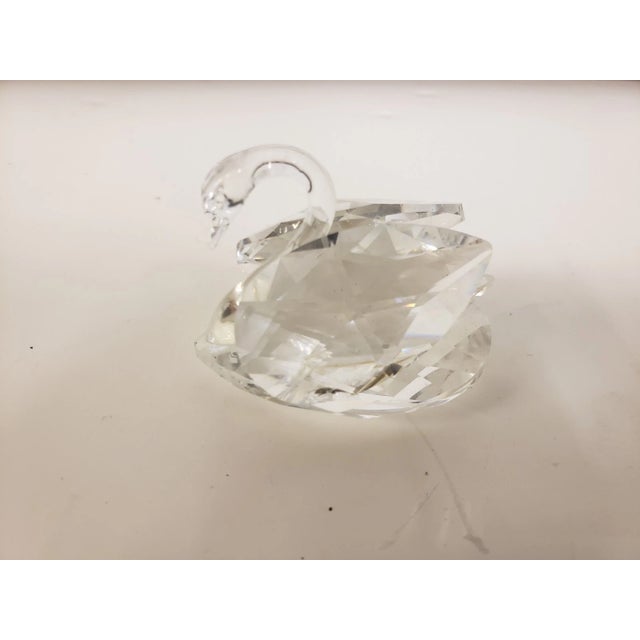 This is a Swarovski Crystal Swan Spread Wing Figurine. It measures 2" high x 2 1/2“ long x 1 3/4" wide. The piece is in...