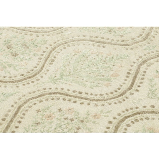 This 4x4 contemporary square block print rug showcases soft botanical medallions framed by flowing wave motifs. Hand-...