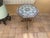 California Yellin School plant stand features wrought iron base with tripod twist foliate and scroll form legs supporting...