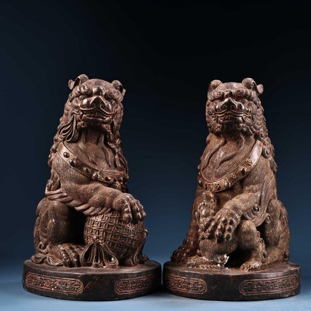 This is a striking pair of vintage gilt bronze guardian lions, also known as Foo Dogs or Shishi. Each lion is seated on a...