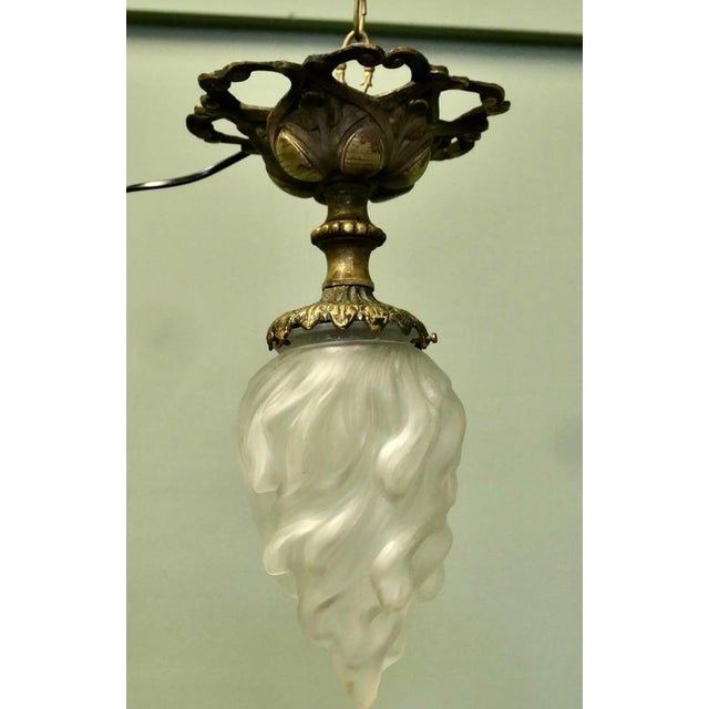 Arts & Crafts Brass Ceiling Light with Flame Glass Shade This wonderful piece is made in heavy brass, it has a decorative...