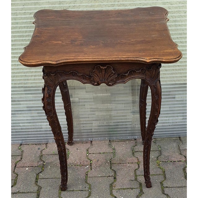 Antique Baroque Side Table in Carved Oak, 1760, in Very Good conditions. Designed before 1890