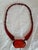 A rare and highly distinctive Art Deco cherry amber Bakelite bead necklace, dating to circa 1920s. The necklace features...