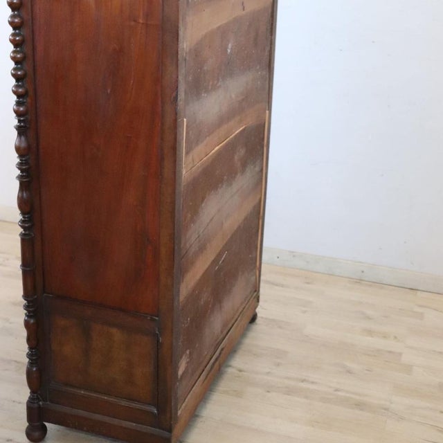 We present this spectacular antique solid walnut wardrobe, made in the mid-19th century in Italy, during the Louis-...