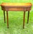 Baker Furniture Company Biggs Furniture, Mahogany, Sheraton Style, Swivel and Hinged Flip Top Mechanism, Game Table, W/Hidden Drawer, Scalloped Edges, and Fluted Legs, 1950 For Sale - Image 4 of 12