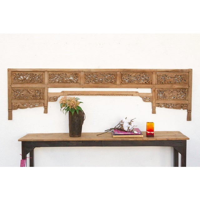 Imagine a time long past, perhaps in a sun-drenched courtyard of a grand noble's house in Java, or adorning the tranquil...