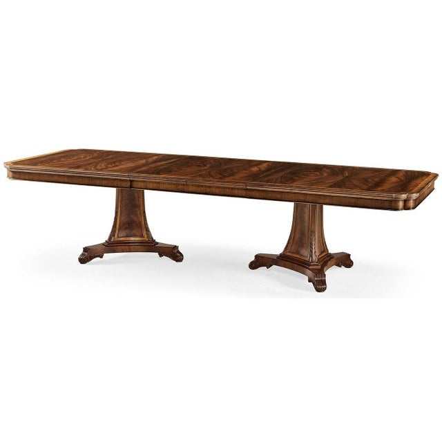 The dining table shows the formal elegance and balanced design of early 19th-century dining furniture. Its long...