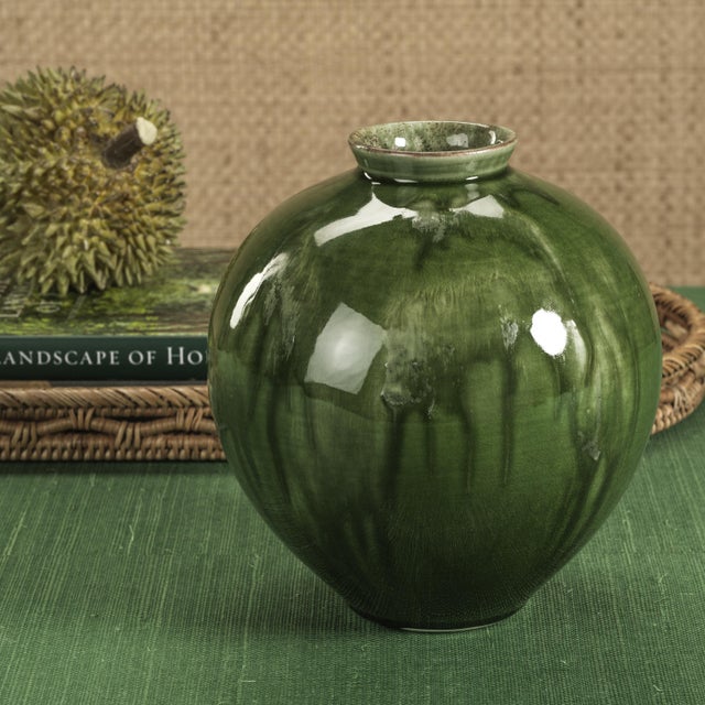 With its rounded silhouette and glossy glazed finish, the Bulbus Ceramic Vase is a refined take on modern décor. The...
