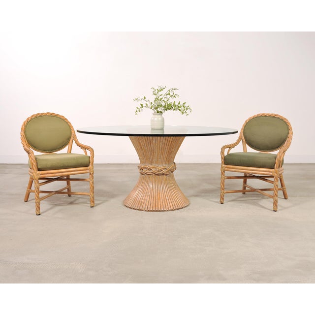 Set of eight rare bespoke dining chairs by McGuire executed in hand-formed twisted rattan in the California coastal...