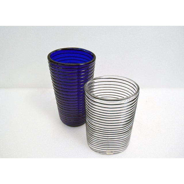 Pair of Boston vases in clear and blue blown glass, with a continuous strand of glass applied hot around the outer wall....