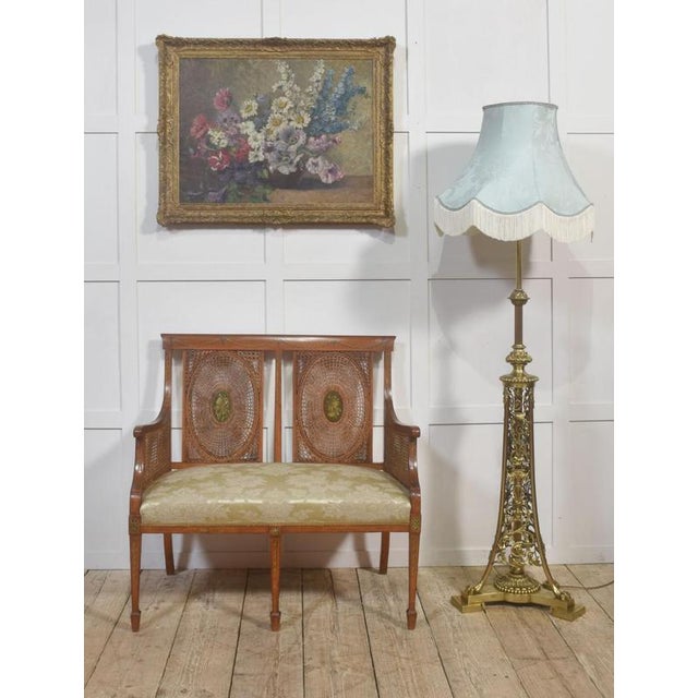 A refined floral still life by Stefanie von Trauttweiller, depicting a generous arrangement of garden flowers—including...