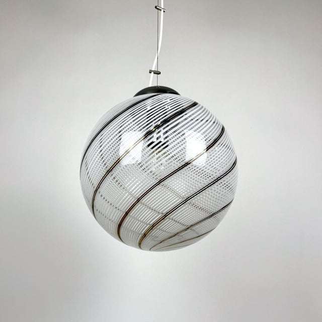 Mid-Century Modern Murano Tessuto Swirl Glass Globe Pendant Lamp from Venini, 1970s, in Very Good conditions. Designed...