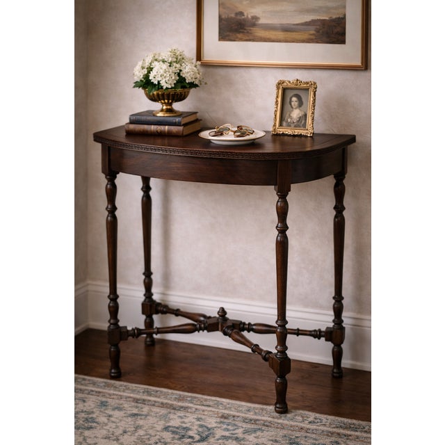 This refined vintage pier or console table brings quiet architectural elegance to an entryway, hallway, or behind-the-sofa...