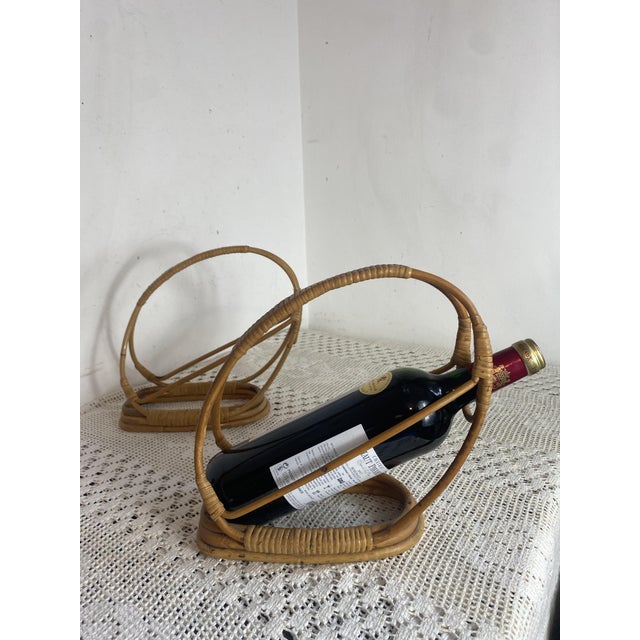 Pair of vintage rattan and bent wicker bottle holders, typical of the 1950s to 1970s. Their clean, organic design allows...