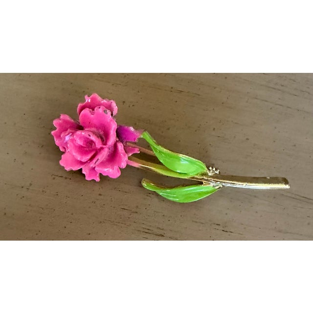 A vibrant pink and green enameled brooch that will look great on any style dress, jacket or hat. Enjoy!