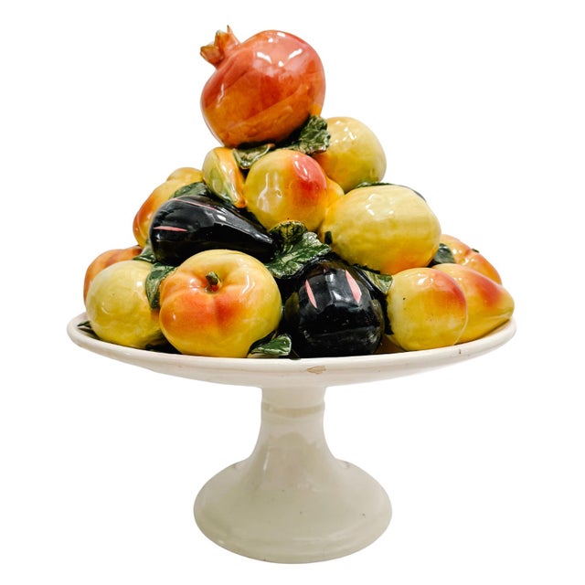 A substantial Spanish faience fruit topiary handcrafted and glazed, and featuring a tiered arrangement of life-sized...